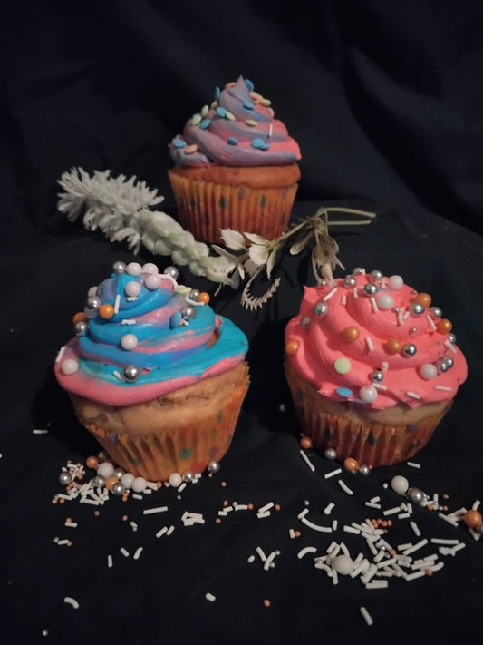Freshly baked large pup-cakes , with banana , honey and peanut butter , topped with a dog friendly cream cheese mix and sprinkles